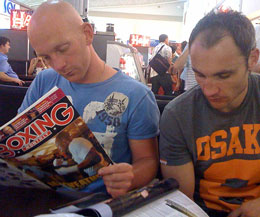 ProKick's finest relax on their trip to Portugal - Stuart Jess reads hard-core boxing news helping him get the right mind-set  while Ian Young take a softer read – Brides to be or is it the Dandy ....Can’t see from here.<strike></strike>