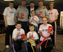 Easter Special Kickboxing Junior winners Kyle Morrison, Matthew Hull, Niamh Dougal and Neave O'Brien with Alan Titmus, Ken Horan, Billy Murray, Frank Byrnes and Anne Gallagher