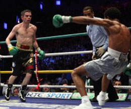 Bernard Dunne knocked the champion down three times in the eleventh round before the referee called a halt to the fight just seconds before the bell