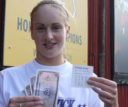 Nicola Davidson collects the winnings for her friend Patricia Melanaphy