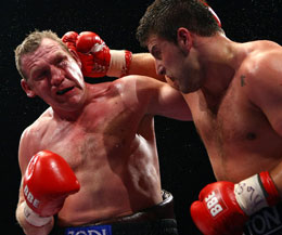 Rogan (left) now a Belfast hero who is classed by many as a real-life Rocky - was only seconds from victory and retaining his Commonwealth Heavyweight title