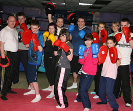 The eager high kicking class received a hard pads class.