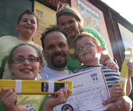 The Anzellini  Family celebrate Dad's yellow belt graduation