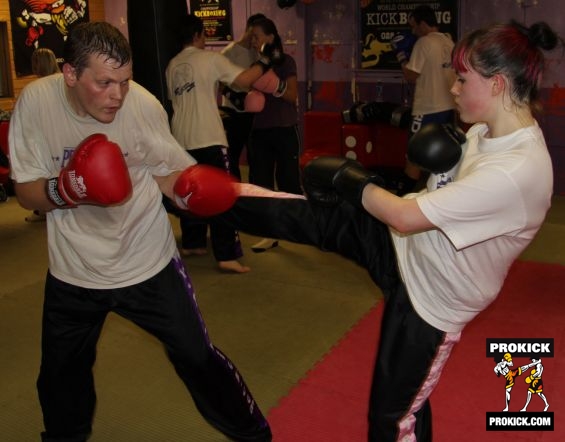 Charlotte throwing a roundhouse with her new sparring partner.-week2-no15