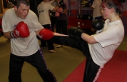 Charlotte throwing a roundhouse with her new sparring partner.-week2-no15