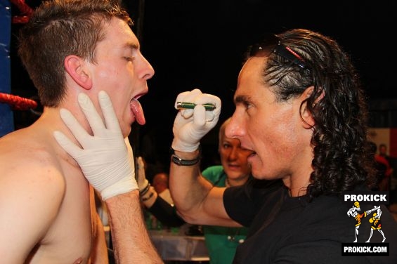Doctor-checks-forde.Quick check up at ringside by the Doc.