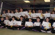 2-kids-group-belters - Group picture of kids getting to their next kickboxing level