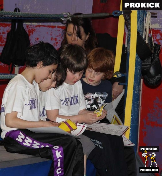 3-kids-group-belters - New yellow belt checking out their new licence's