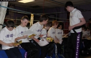 4-kids-group-belters - Black Belt Kyle Morrison keeping a watchful eye on the students