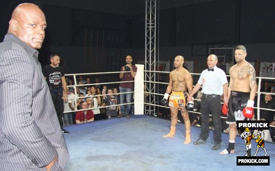 Ernesto Hoost looks on.