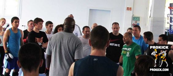 Group of kickboxers listen at Hoost seminar in Geneva