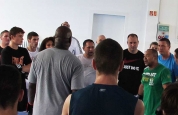 Group of kickboxers listen at Hoost seminar in Geneva