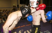 Pope and Cox in kickboxing action 
