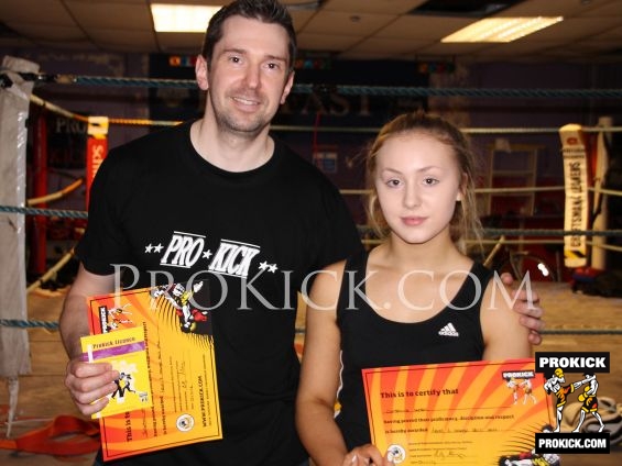 Dad and daughter kick-it at grading day