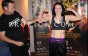 Rowena flexes muscles for coach
