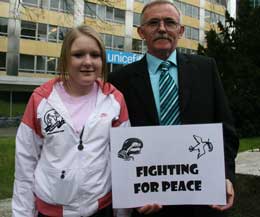 Young Abie Macartney - pictured here with her GrandDad Desi Macartney - helped launch the Fighting For Peace in Geneva where she demonstrated her skill at the UN capital along with Geneva’s Michael Dottrens in front of top Ambassadors