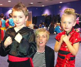 The duo (pictured with their elated mum Gail) are on the same team P1-P3 ages 5-7 year-old