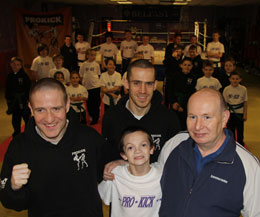 Ferris (Centre) pictured with his dad Mr Stephenson along with ProKick' instructors Gary Fulerton and Davy Foster