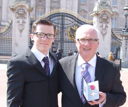 Proud Stephen Houston with his Father outside Buckingham Palace with his OBE