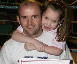 Stevie Kidd with daughter, Morgan after she progressed and achieving her yellow belt.