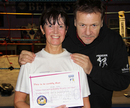 Pauline 'Granny G' Goody receiving her 1st Brown Belt from ProKick head coach Billy Murray