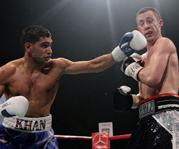 Amir Khan lands a left on Paul McCloskey's chin in Manchester