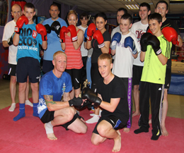 ProKick member Kurtis Gillespie receiving his winner's trophy from fighter Darren 'Smiler' McMullan